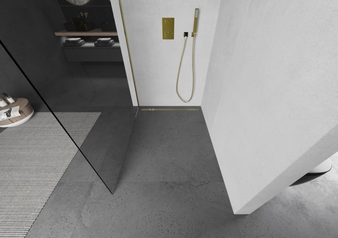 Golden shower panel in a gray bathroom