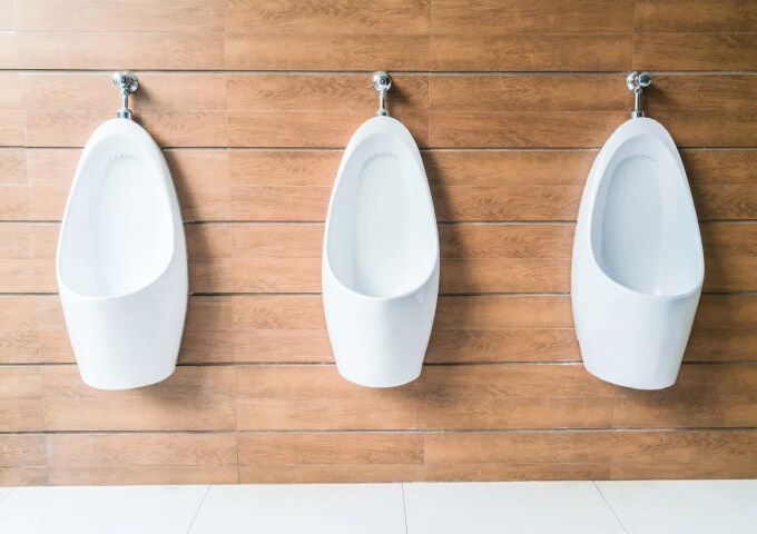 Urinals in a public bathroom