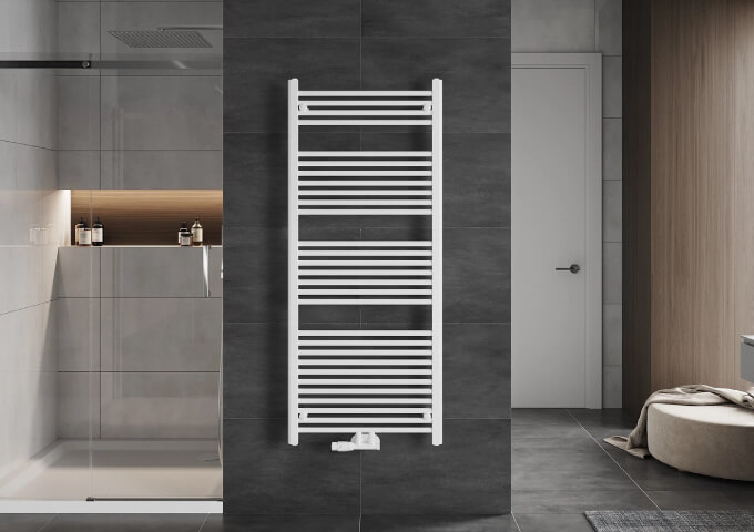 Radiator with white radiator valve in the bathroom