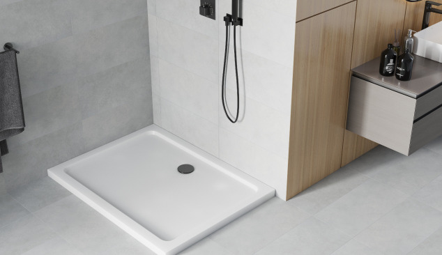 White shower tray with black accessories