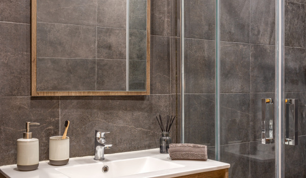 At what height should shower baskets be hung?