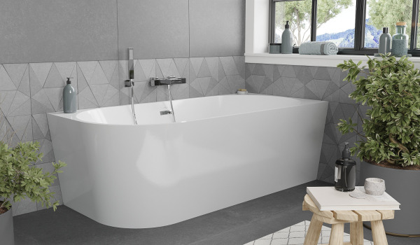 Freestanding bathtub in a gray bathroom inspired by nature
