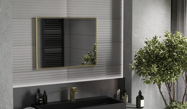 Gold details in a dark bathroom